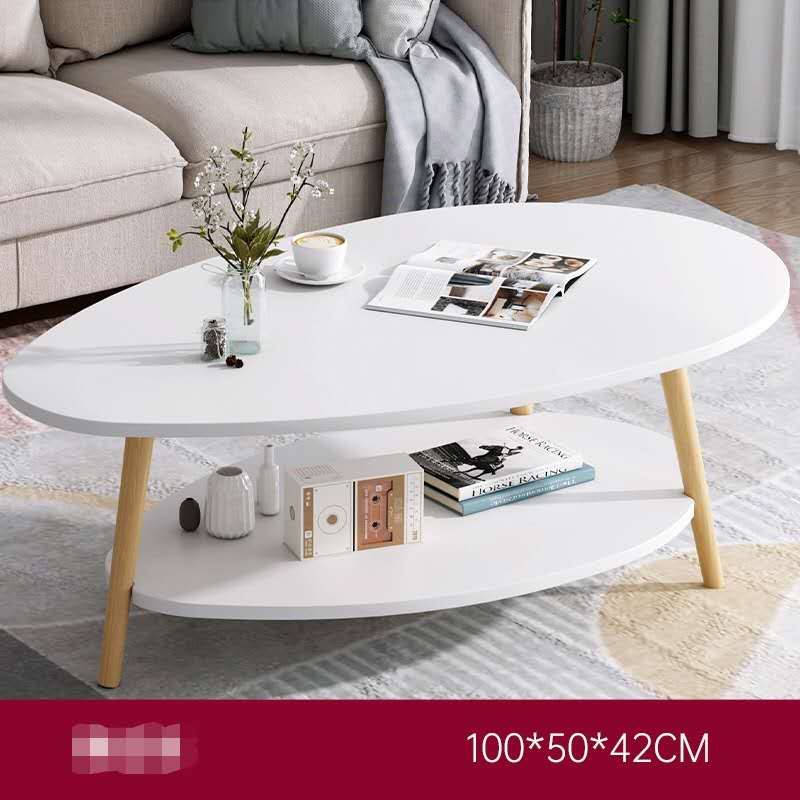 White coffee table with wooden legs in a living room setting